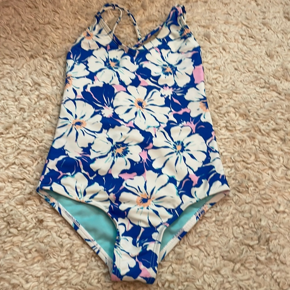Girls swimsuit. In good condition. Has a yellow stain as seen on last pic.